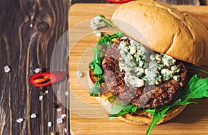 Fresh burger with blue cheese and arugula