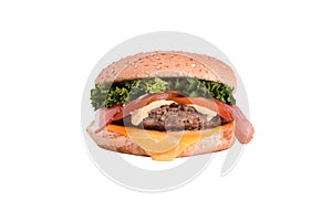 Fresh burger with pork and beef cutlet, bacon, cheddar cheese, caesar sauce isolated on white background.