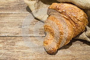 Fresh butter croissant in gunny sack cloth