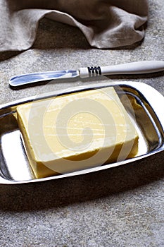 Fresh butter and knife in butter-dish