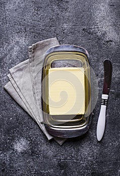 Fresh butter and knife in butter-dish