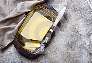 Fresh butter and knife in butter-dish