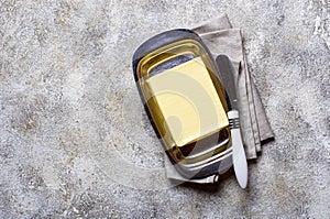 Fresh butter and knife in butter-dish