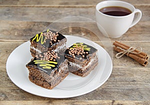 Fresh cakes on a plate and tea.