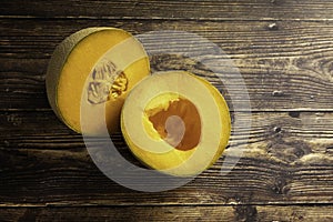 Fresh Cantaloupe on a Wood Plank Board Background