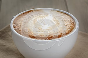 Fresh cappuccino cup with simple latte art
