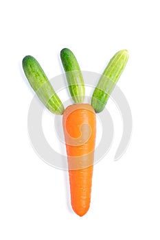 Fresh carrot with cucumber decorated as leaves on white background
