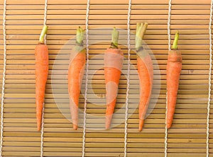 Fresh carrots on bamboo floor