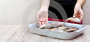 Fresh catch of river fish in a bowl on the table