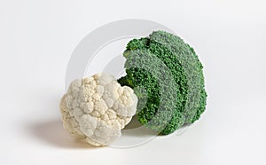 Fresh cauliflower and green broccoli on white background. Healthy natural organic food. Vegetables closeup