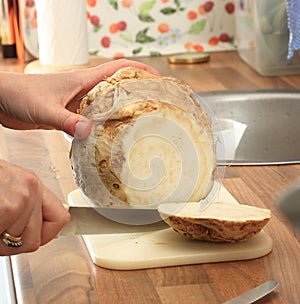 Fresh Celeriac Beeing Cut photo