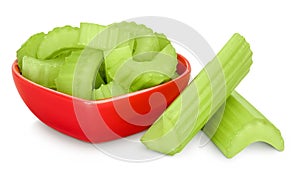 fresh celery in ceramic bowl isolated on white background with full depth of field