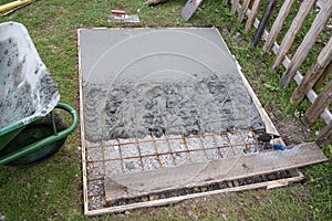 Fresh cement in a hole in backyard