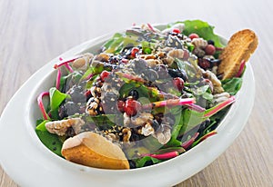 Fresh chard salad, caramelized walnuts, forest fruits. cherry tomato confit and honey