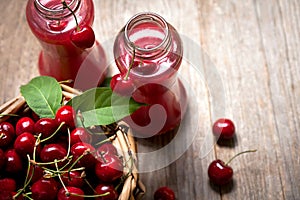 Fresh cherries in bowl on table