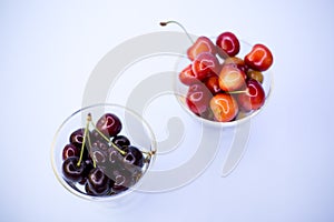 Fresh cherries in bowl on table