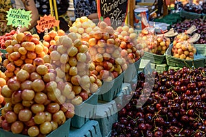 Fresh cherries in an indoor farmers market