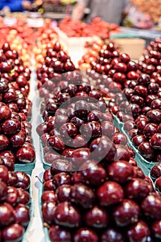 Fresh cherries in an indoor farmers market