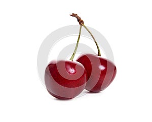 Fresh cherries with leaf isolated on white background