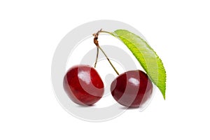 Fresh cherries with leaf isolated on white background