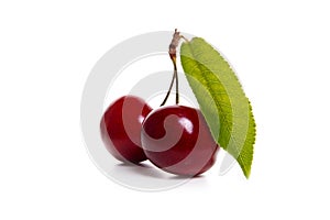 Fresh cherries with leaf isolated on white background