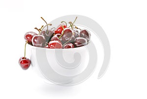 Fresh Cherries in white bowl. Cherries isolated on white background