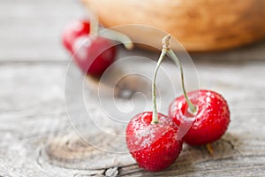 Fresh cherries on wooden background. Red ripe cherry