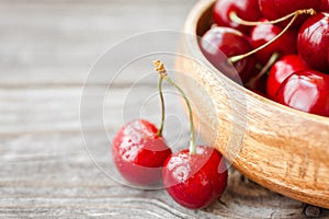 Fresh cherries on wooden background. Red ripe cherry