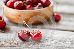 Fresh cherries on wooden background. Red ripe cherry