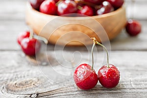 Fresh cherries on wooden background. Red ripe cherry