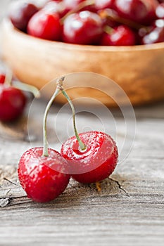 Fresh cherries on wooden background. Red ripe cherry