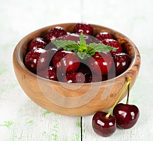 Fresh cherries in a wooden bowl