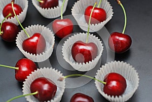 Fresh Cherry Fruit Health Vitamine in Cooking Bakery Cupcake Paper. Black Background Copy Space.