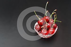 Fresh Cherry Fruit Health Vitamine in Cooking Bakery Cupcake Paper. Black Background Copy Space.