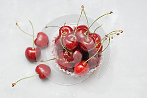Fresh Cherry Fruit Health Vitamine in Cooking Cupcake Paper. Isoalted Light Background. Selective Focus. copy space.
