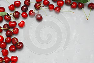 Fresh Cherry Fruit Health Vitamine Frame Textured Gray Cement Background with Copy Space. top View.