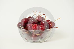 Fresh cherry glass bowl ready to serve. White background and perfect for adding text