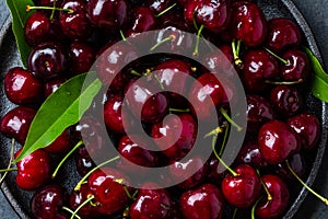 Fresh cherry with leaves. Background top view