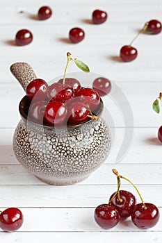 Fresh cherry on plate on wooden background. fresh ripe cherries