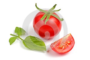Fresh cherry tomato and slice isolate on a white background, close-up