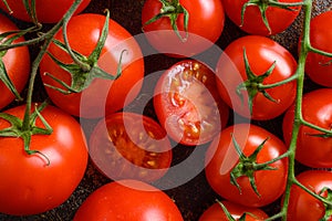 Fresh cherry tomatoes on a metal rustic old background half sliced and whole art close up