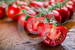 Fresh cherry tomatoes washed clean water. Cut fresh tomatoes