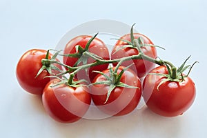 Fresh cherry tomatoes on white background