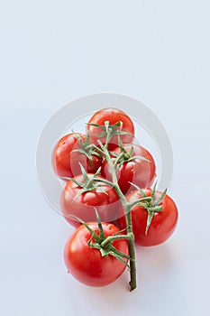 Fresh cherry tomatoes on white background