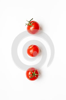 Fresh cherry tomatoes on a white background , flat lay. Raw food and vegetable concept