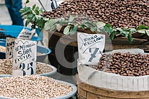 Fresh chestnuts and nuts in bags with price tags on the Egyptian market.