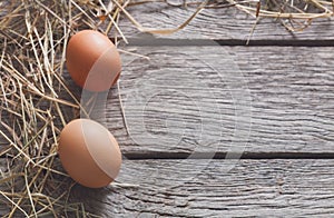 Fresh chicken brown eggs on rustic wood, organic farming concept