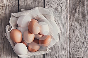 Fresh chicken brown eggs on rustic wood, organic farming concept