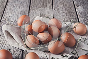 Fresh chicken brown eggs on rustic wood, organic farming concept