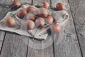 Fresh chicken brown eggs on rustic wood, organic farming concept